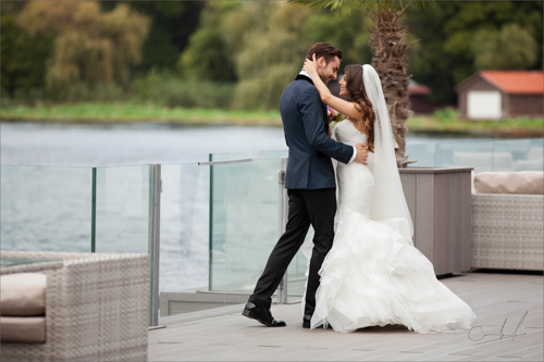 Bride and groom at their first look on a lake